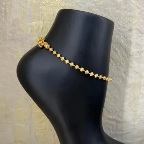 Gold Alternative Anklet With Cascading Beads And A Soft Bell
