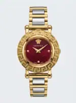 Luxury watch with red dial and gold-tone case and bracelet.