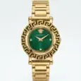 Luxury watch with gold band and green dial, Versace logo and Greek key bezel.