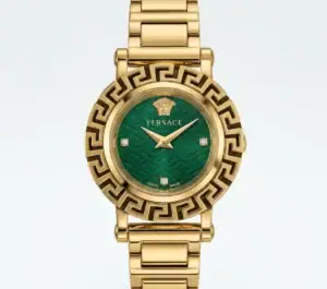 Luxury watch with gold band and green dial, Versace logo and Greek key bezel.