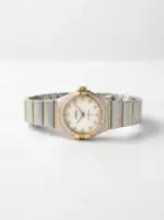 Luxury women's watch with two-tone gold and silver finish and diamond accents.