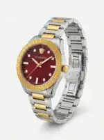 Luxury Versace watch with red dial, gold and silver band, Greek key bezel.