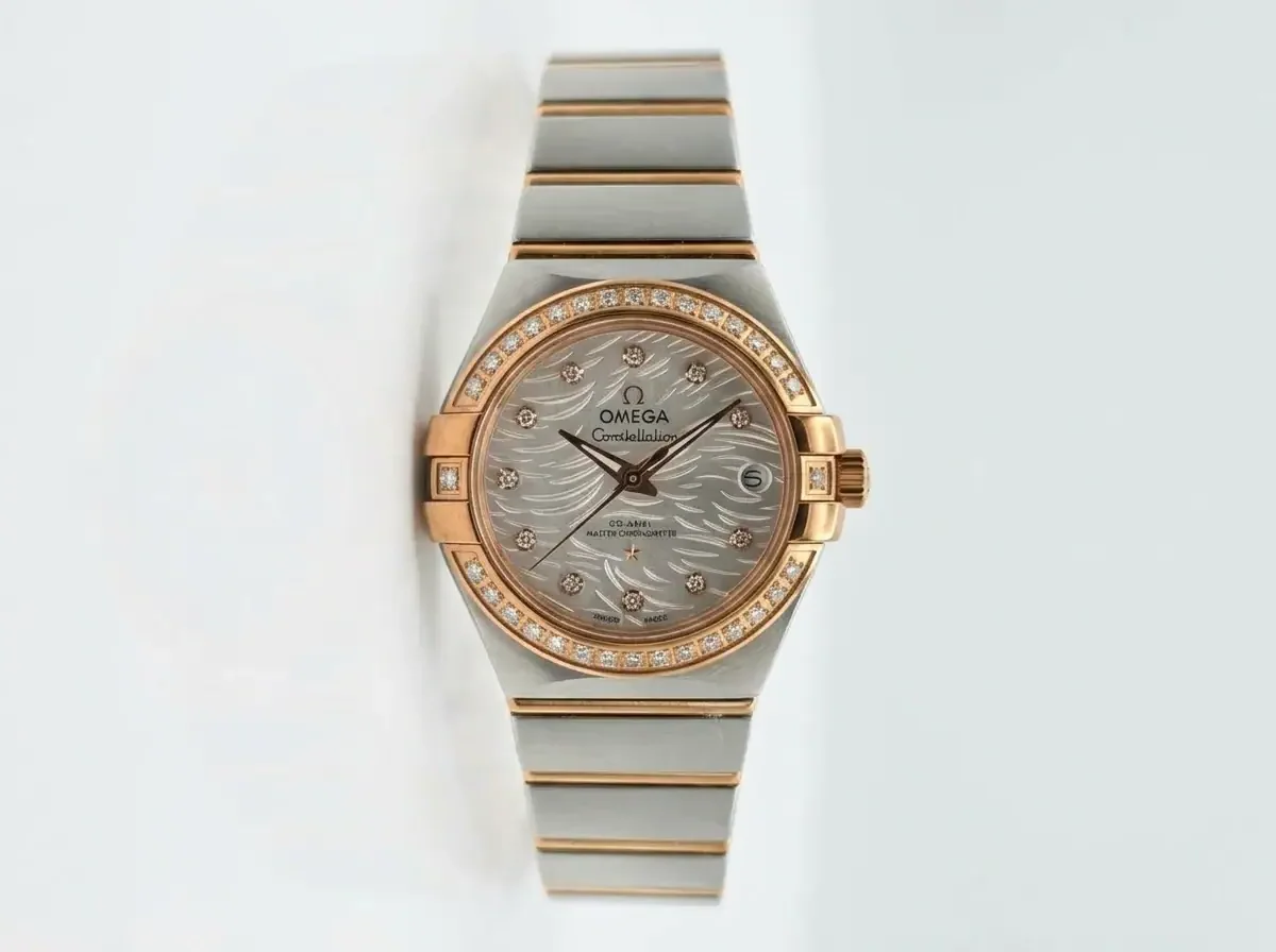 Omega Constellation Diamond Feather Dial Watch Luxury Omega Constellation watch with diamond-studded bezel and feather-patterned dial.