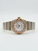Luxury Omega Constellation watch with mother-of-pearl dial and diamond accents.