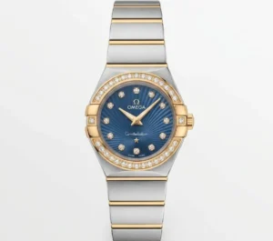 Luxury Omega Constellation watch with blue dial, diamond accents, and two-tone bracelet.