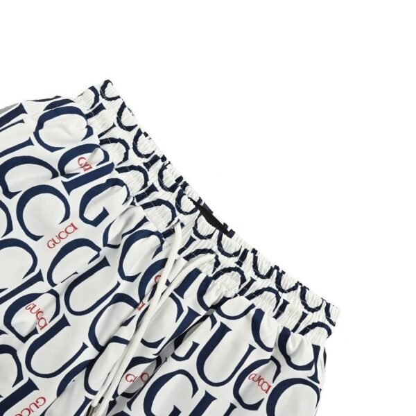 Gucci All-Over Logo Print White and Navy Drawstring Swim Shorts - Image 6