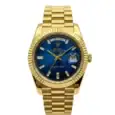 Gold Rolex Day-Date watch with blue dial and date display.