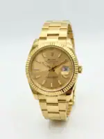 Luxury gold Rolex watch with champagne dial and date display.