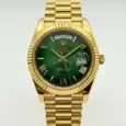 Luxury Rolex Day-Date watch with green dial and gold bracelet.