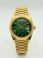 Luxury Rolex Day-Date watch with green dial and gold bracelet.