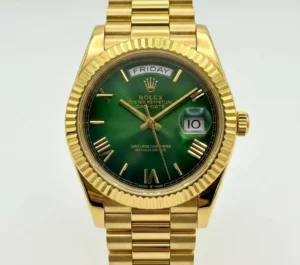 Luxury Rolex Day-Date watch with green dial and gold bracelet.