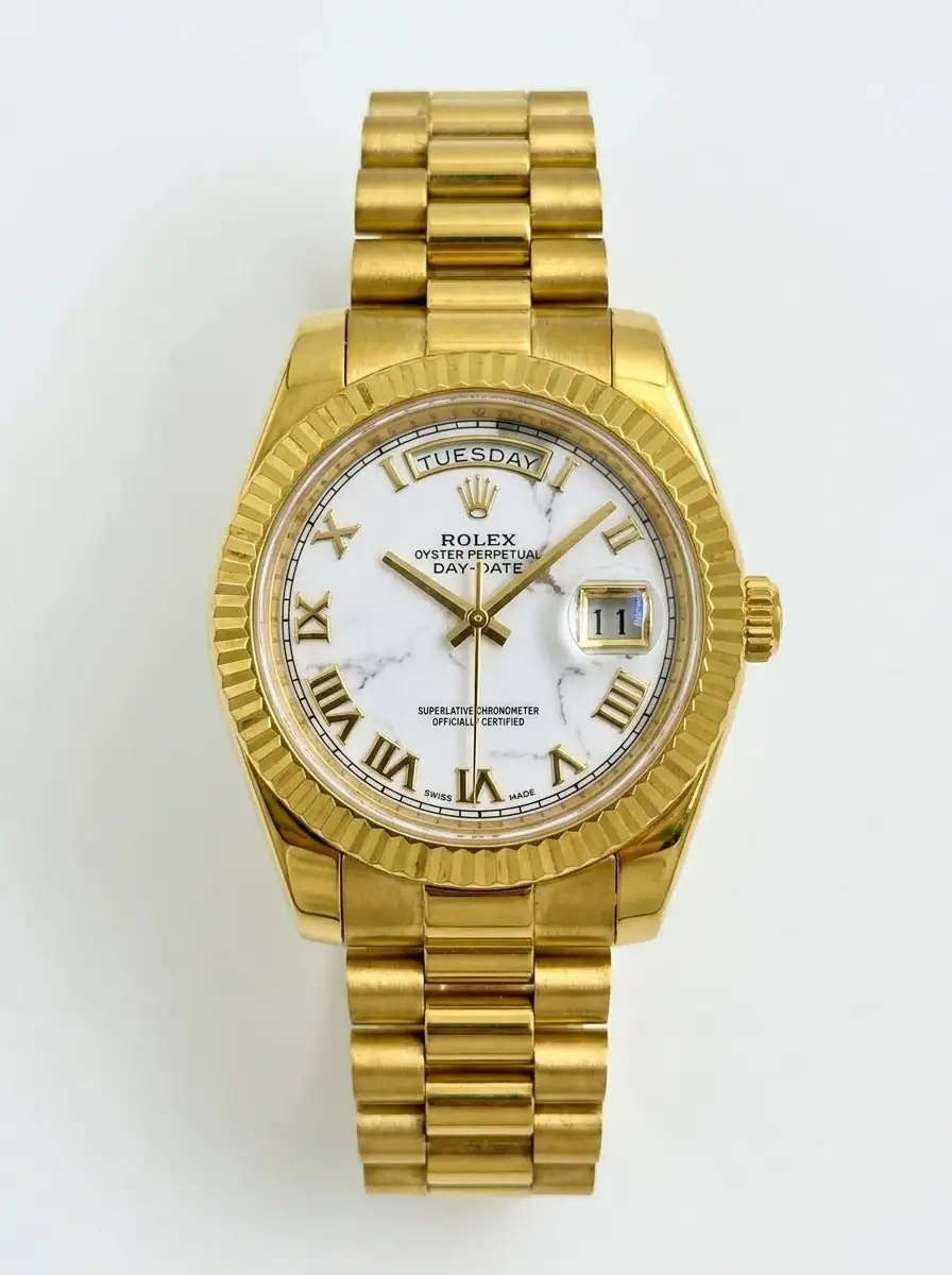 Rolex Day-Date Marble Gold Watch Luxury gold Rolex Day-Date watch with marble dial and day-date display.