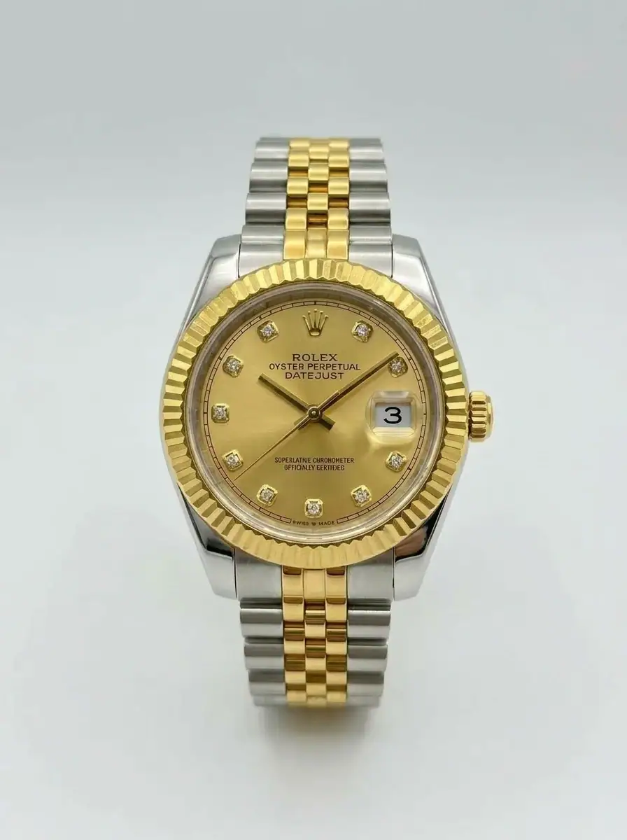 Rolex Datejust Two-Tone Diamond Watch Luxury Rolex Datejust watch with gold and silver band and diamond hour markers.
