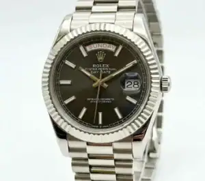 Rolex Day-Date silver stainless steel watch with black dial and date display.