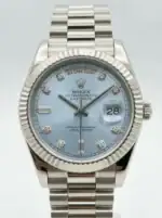 Rolex Day-Date watch with ice blue dial and diamond hour markers.