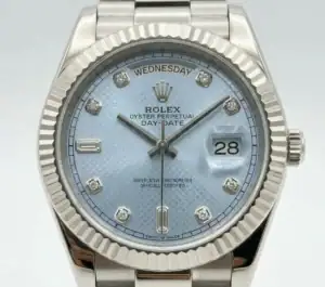 Rolex Day-Date watch with ice blue dial and diamond hour markers.