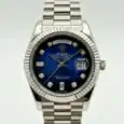 Rolex Day-Date watch with blue dial and diamond hour markers.