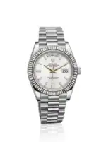 Rolex Day-Date watch with white dial and steel bracelet, date and day display.