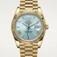Luxury gold Rolex Day-Date watch with ice blue dial and day-date display.