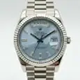 Rolex Day-Date watch with ice blue dial and diamond hour markers.