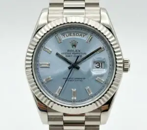 Rolex Day-Date watch with ice blue dial and diamond hour markers.