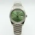 Rolex Day-Date watch with green dial, Roman numerals, and stainless steel band.