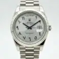 Rolex Day-Date watch with Arabic numerals and steel bracelet.