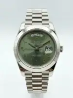 Rolex Day-Date watch with green dial and Arabic numerals in steel.