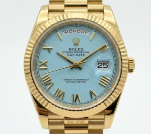 Rolex Day-Date watch with turquoise dial and gold bracelet, day and date display.
