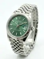 Rolex Datejust with green dial, stainless steel band, and date window.