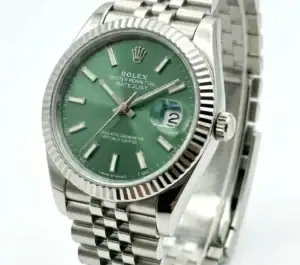 Rolex Datejust with green dial, stainless steel band, and date window.