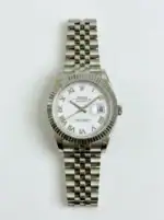 Rolex Datejust watch with white dial, Roman numerals, and stainless steel bracelet.
