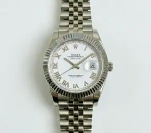 Rolex Datejust watch with white dial, Roman numerals, and stainless steel bracelet.