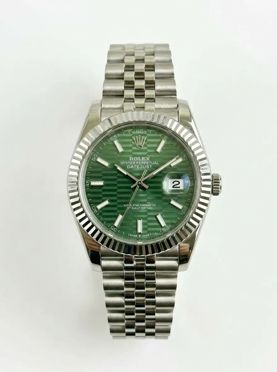Rolex Datejust Green Motif Watch Rolex Datejust with green dial, silver bracelet, and date display.