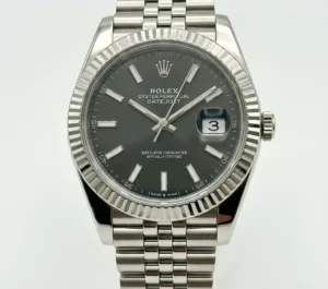 Rolex Datejust with black dial, silver bracelet, date display, fluted bezel.