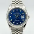 Rolex Datejust with blue dial, diamond hour markers, and stainless steel bracelet.