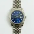 Rolex Datejust watch with blue dial and stainless steel bracelet.