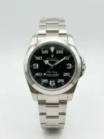 Rolex Air-King watch with black dial and stainless steel band.