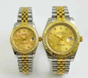 Two-tone Rolex Datejust watches for couple, gold and silver, with diamond markers.
