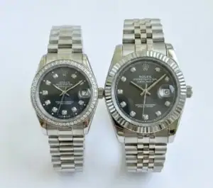 Silver Rolex Datejust couple watches with black dials and diamond markers.