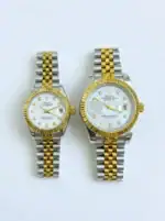 Pair of Rolex Datejust watches with gold and silver band and pearl dial.