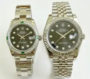 Pair of Rolex Datejust watches with silver bands and black dials, one with diamond hour markers.