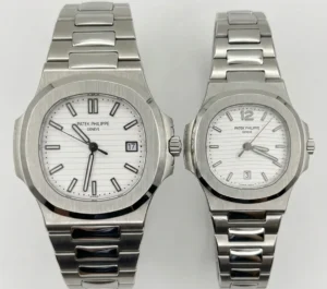 Pair of Patek Philippe Nautilus watches in silver with white dials.