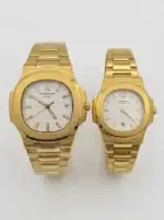 Gold Patek Philippe Nautilus couple watches with white dials and gold bracelets.