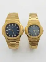 Gold Patek Philippe Nautilus couple watches with blue dials and gold bracelets.
