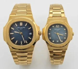 Gold Patek Philippe Nautilus couple watches with blue dials and gold bracelets.